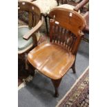 An Edwardian mahogany desk chair.