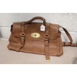 A ladies' brown leather handbag.