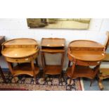 A pair of hardwood oval occasional tables and a similar table.