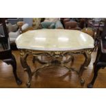 A marble top giltwood coffee table.