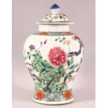 A CHINESE FAMILLE ROSE PORCELAIN JAR & COVER - decorated with scenes of native floral landscape