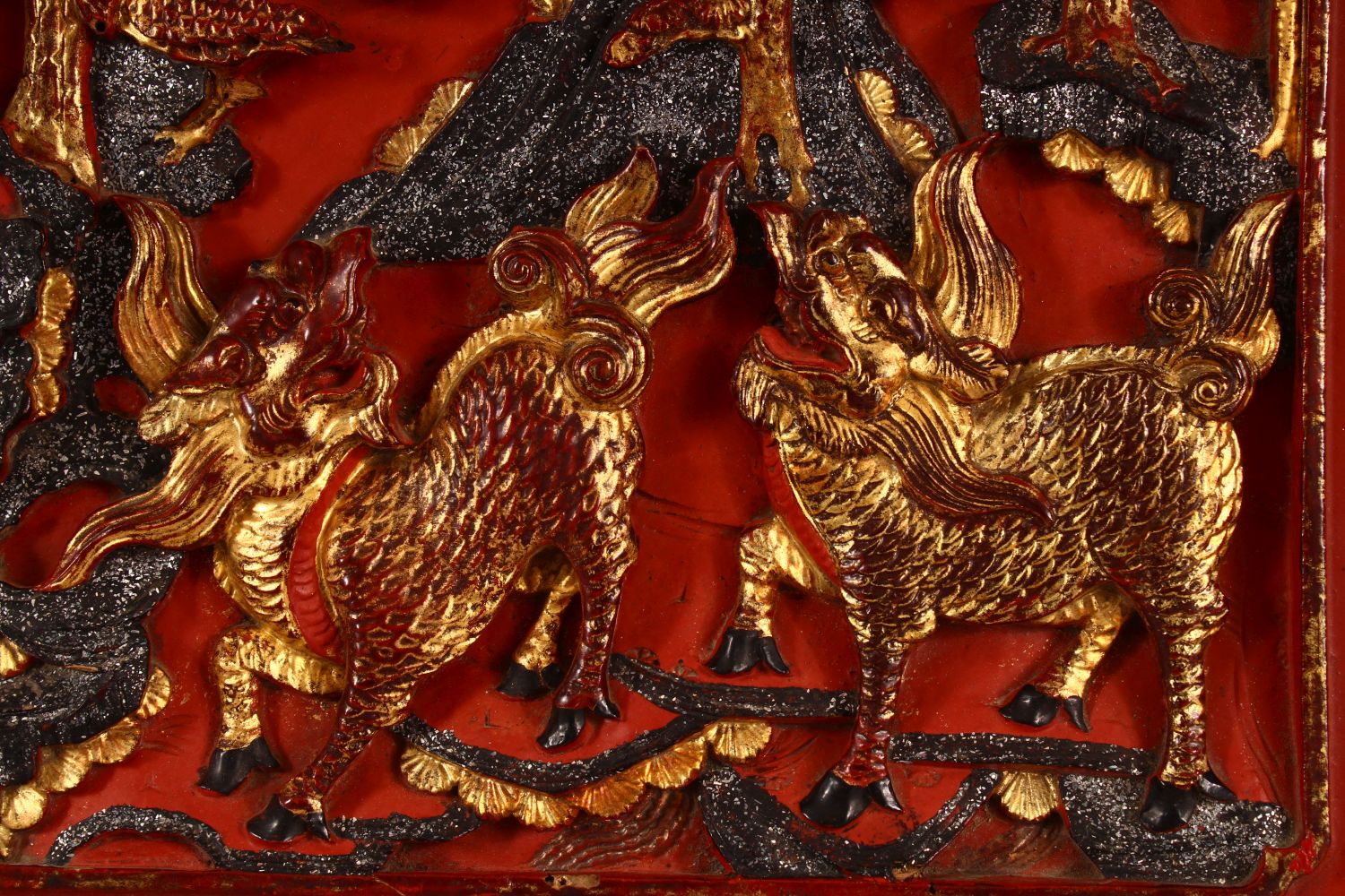 AN UNUSUAL CHINESE LACQUERED CARVED WOOD PANEL, the panel carved with kylin and phoenix, possibly - Image 2 of 5