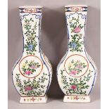 A PAIR OF CHINESE STYLE PORCELAIN VASES, painted with flowers, 31cm high.