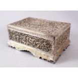 A 19TH CENTURY INDIAN OPENWORK WHITE METAL LIDDED BOX, decorated in open work depicting birds and