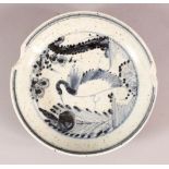 A CHINESE BLUE & WHITIE PORCELAIN PLATE, decorated with a bird and flora, the underside with a six