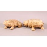 A PAIR OF CHINESE 19TH / 20TH CENTURY CARVED SOAPSTONE FROGS, the opposing pair in a recumbent pose,