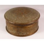 A 19TH CENTURY SIKH PIERCED BRASS TURBAN BOX, the box and cover with profusely pierced and chased