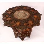 A FINE 19TH CENTURY INDIAN KASHMIRI CARVED WOODEN TABLE - the top carved in relief with leaves and
