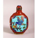 A CHINESE CLOISONNE SNUFF BOTTLE - decorated with a red ground and wire clouds with two panels of