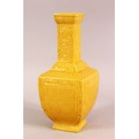 A SMALL CHINESE YELLOW GROUND SQUARE FORM VASE, with relief decoration of bats and stylised flora,