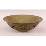 A CHINESE LONGQUAN STYLE CELADON GLAZED DISH - the interior carved with flora , of double skin