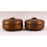 A PAIR OF INDIAN SPICE BOXES, both with hinged lid and handle to top, both approx. 21cm diameter.