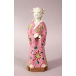 A 19TH CENTURY CHINESE FAMILLE ROSE PORCELAIN FIGURE, decorated cloak in pink ground with floral
