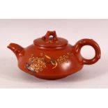 A CHINESE YIXING CLAY TEAPOT & COVER - decorated with raised birds and foliage, the base with a