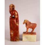 TWO CHINESE CARVED SOAPSTONE SEALS, one carved with lion dog, the other with a horse, 13.5cm and 8cm