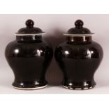 A PAIR OF CHINESE FAMILLE NOIR PORCELAIN GINGER JARS & COVERS, 30cm