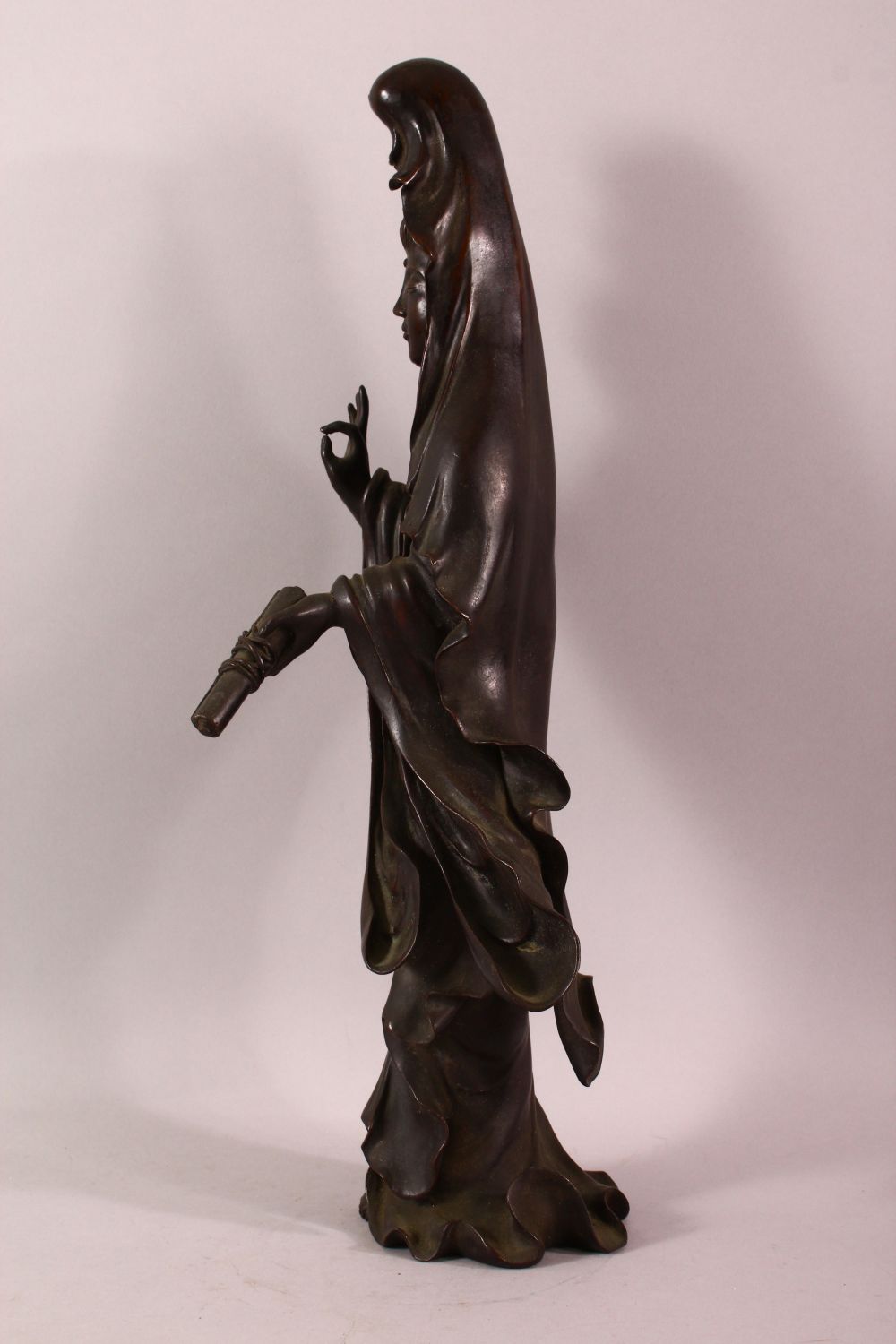A CHINESE BRONZE FIGURE OF GUANYIN holding a scroll, her other hand raised in a mindfulness gesture, - Image 4 of 8