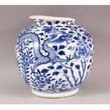 A CHINESE BLUE AND WHITE PORCELAIN VASE, painted with dragons amongst flowers, four character mark