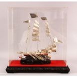 A 20TH CENTURY CHINESE SILVER MODEL OF A JUNK / SHIP - the ship mounted to a hardwood base, hosed in