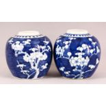 TWO CHINESE BLUE AND WHITE PRUNUS GINGER JARS, 13cm high.