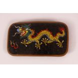 A CHINESE CLOISONNE ENAMEL DRAGON BELT BUCKLE - depicting a dragon upon black ground with flames,