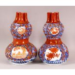 A PAIR OF ORIENTAL IMARI PORCELAIN GOURD VASES, each with three openings to the neck, in the form of