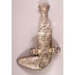 A SMALL ISLAMIC DAGGER, possibly low grade silver, and sheath, 20cm long.