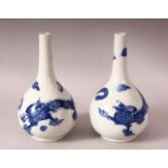 A PAIR OF 19TH / 20TH CENTURY CHINESE BLUE & WHITE PORCELAIN VASES - each decorated with scenes of a