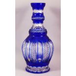 A LARGE ISLAMIC BLUE BOHEMIAN CUT GLASS HUQQA BASE, 34cm high.