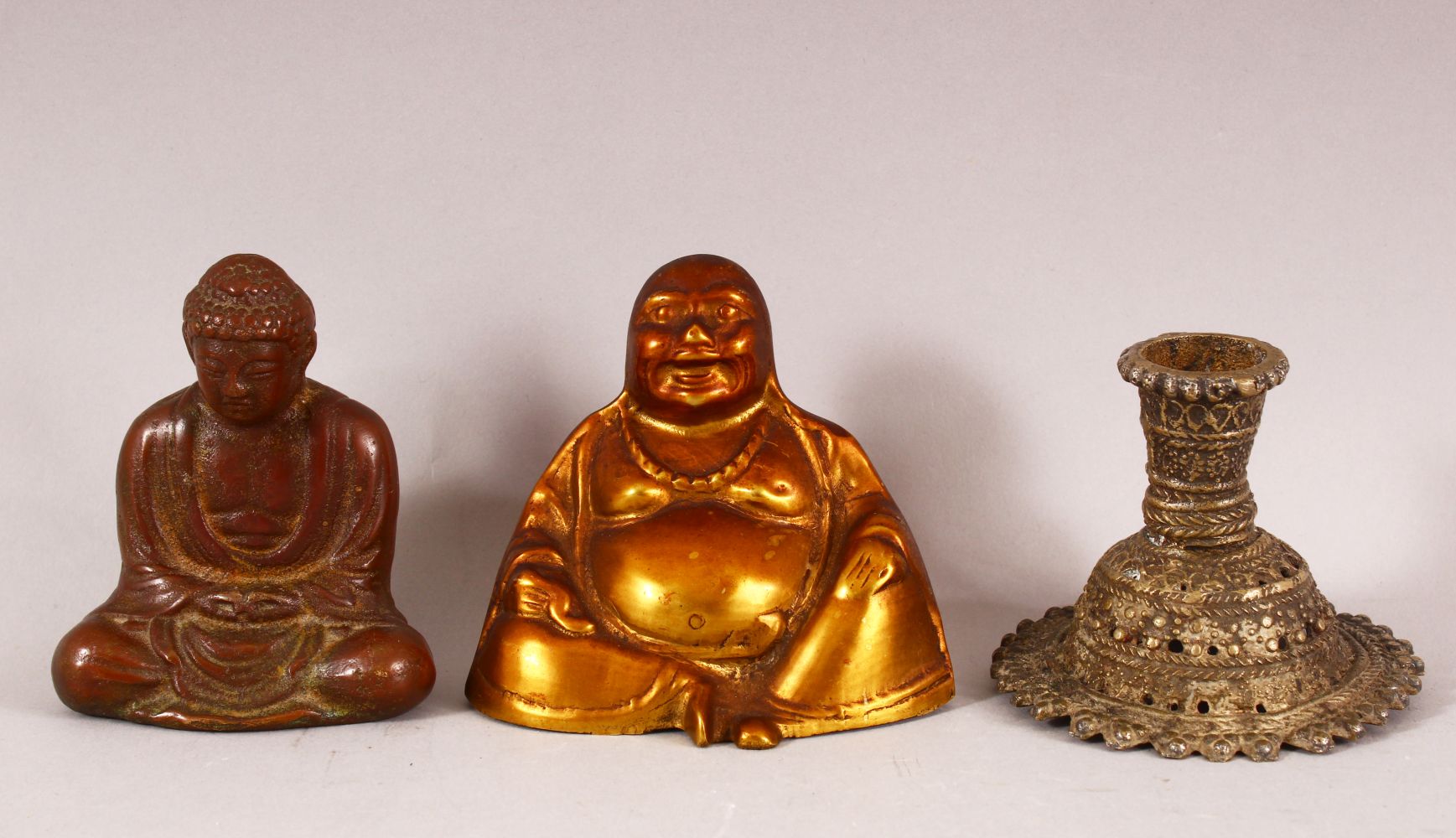 A SMALL BRONZE BUDDHA, together with two other metal items, buddha 9cm high.