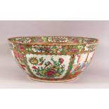 A LARGE 19TH CENTURY CHINESE CANTON FAMILLE ROSE PORCELAIN BOWL - with panel decoration of