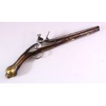 AN 18TH CENTURY ANGLO INDIAN FLINTLOCK PISTOL, engraved barrel, carved stock with wire inlaid
