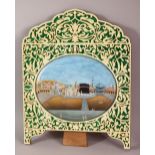 AN OVAL MINIATURE PAINTING OF MECCA ON CARD, displayed in a pierced decorative frame, 33cm x 26cm.