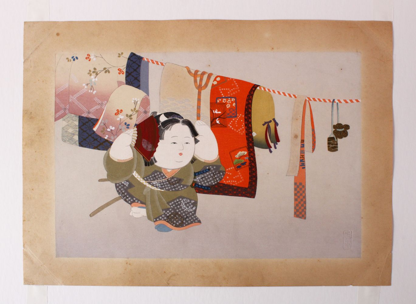 A EARLY 20TH CENTURY JAPANESE WOODBLOCK PRINT - JAPANESE FESTIVAL - a female figure holding a fan