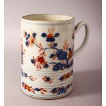 AN 18TH CENTURY CHINESE IMARI PORCELAIN TANKARD - decorated with underglaze blue and orange floral