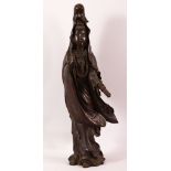 A CHINESE BRONZE FIGURE OF GUANYIN holding a scroll, her other hand raised in a mindfulness gesture,