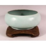 A CHINESE SONG STYLE POTTERY CELADON BOWL & STAND - the bowl with a celadon crackle glaze, the
