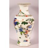 A CHINESE FAMILLE VERTE PORCELAIN VASE, decorated with scenes of immortal figures, the base with a