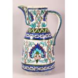 A GOOD IZNIK STYLE POTTERY EWER - finely decorated with colourful floral motifs, Poss 19thc, 27cm