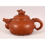 A CHINESE YIXING CLAY RAMS HEAD TEAPOT, in the form of a rams head and finail of a ram, the
