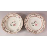 A PAIR OF 18TH CENTURY CHINESE FAMILLE ROSE PORCELAIN PLATES - each decorated with scenes or