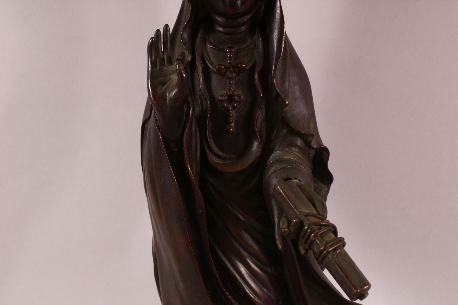 A CHINESE BRONZE FIGURE OF GUANYIN holding a scroll, her other hand raised in a mindfulness gesture, - Image 6 of 8