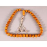 A FINE SET OF CHINESE OR ISLAMIC AMBER PRAYER BEADS, the string comprising of 35 beads and toggle