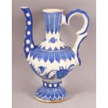 A TURKISH IZNIK POTTERY WATER SURAHI CARAFE - with flowing floral decorations, 20cm