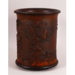 A CHINESE BAMBOO CARVED BRUSH POT - decorated with village landscape scenes, 15cm diameter