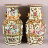 TWO 19TH CENTURY CHINESE CANTON FAMILLE ROSE PORCELAIN VASES, with panel decoration of figures,