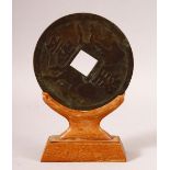 A CHINESE ARCHAIC STYLE BRONZE BI DISK / CURRENCY - with central raised horse decoration and