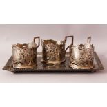 A PERSIAN TABRIZ "NIELLO" SILVER CAT TRAY & THREE MUG HOLDERS - the tray with carved decoration