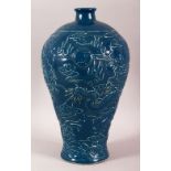 A CHINESE BLUE GROUND POTTERY DRAGON VASE, with dragons either side of the pearl of wisdom against