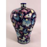AN UNUSUAL CHINESE BLUE GROUND PORCELAIN BUTTERFLY VASE, the body profusely decorated with